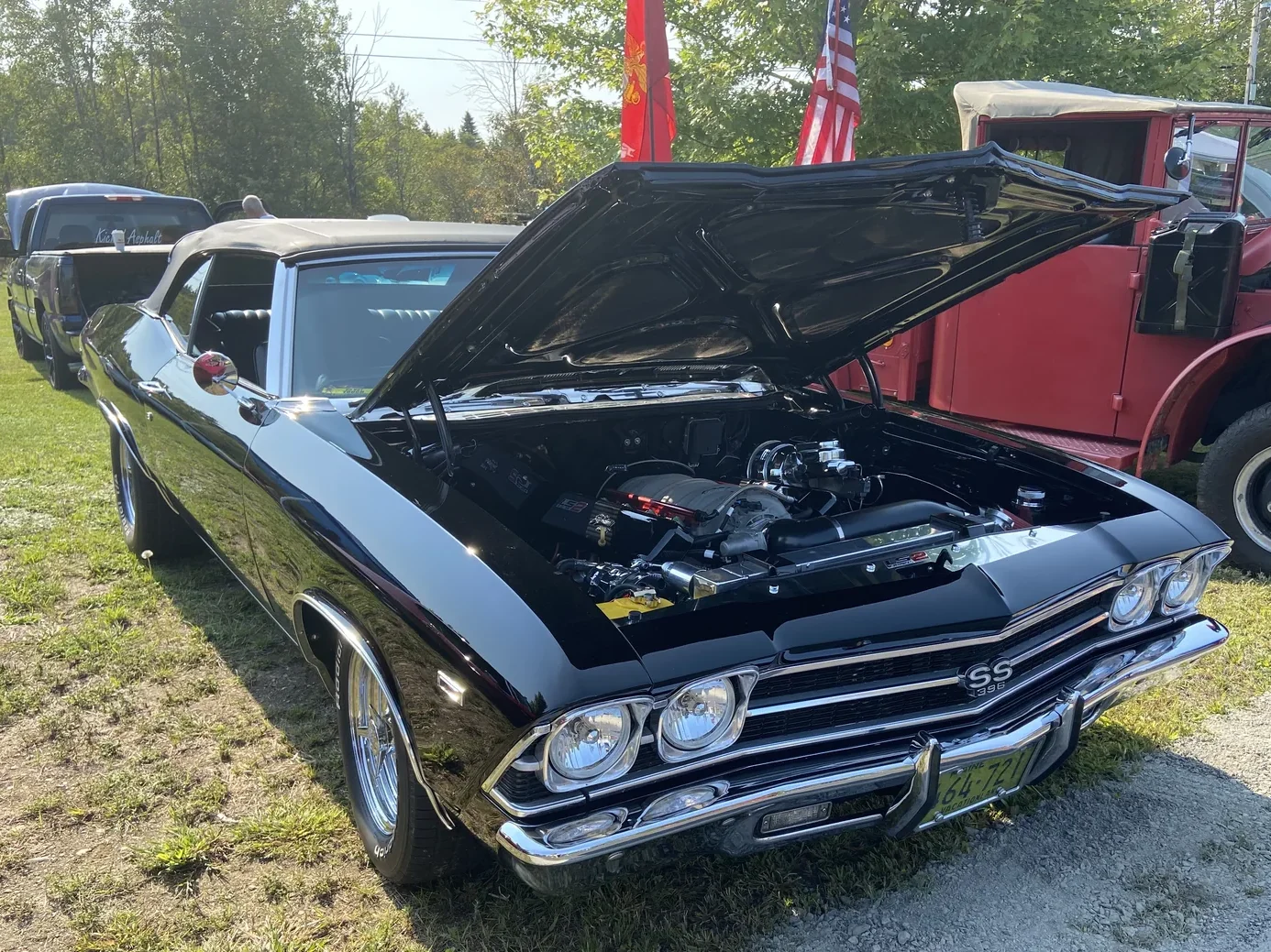 Black 1969 Chevrolet Chevelle SS 396 convertible with its hood open at Freddie's Cruise-In 2022.