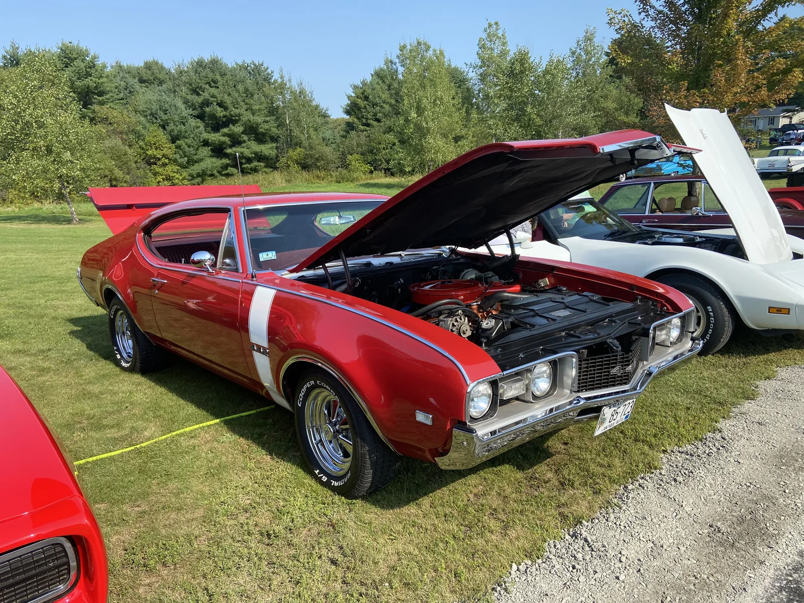 Red 1969 Oldsmobile 4-4-2 with its hood open at Freddie's Cruise-In 2022.