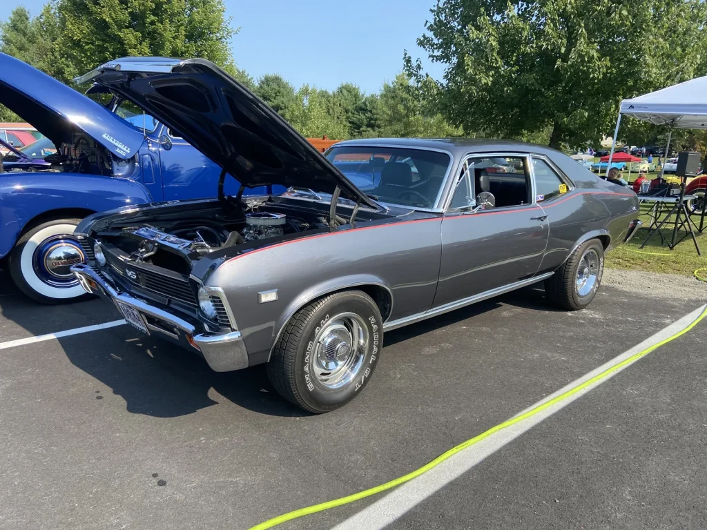 Gray 1971–1972 Chevrolet Nova SS with its hood open at Freddie's Cruise-In 2022.