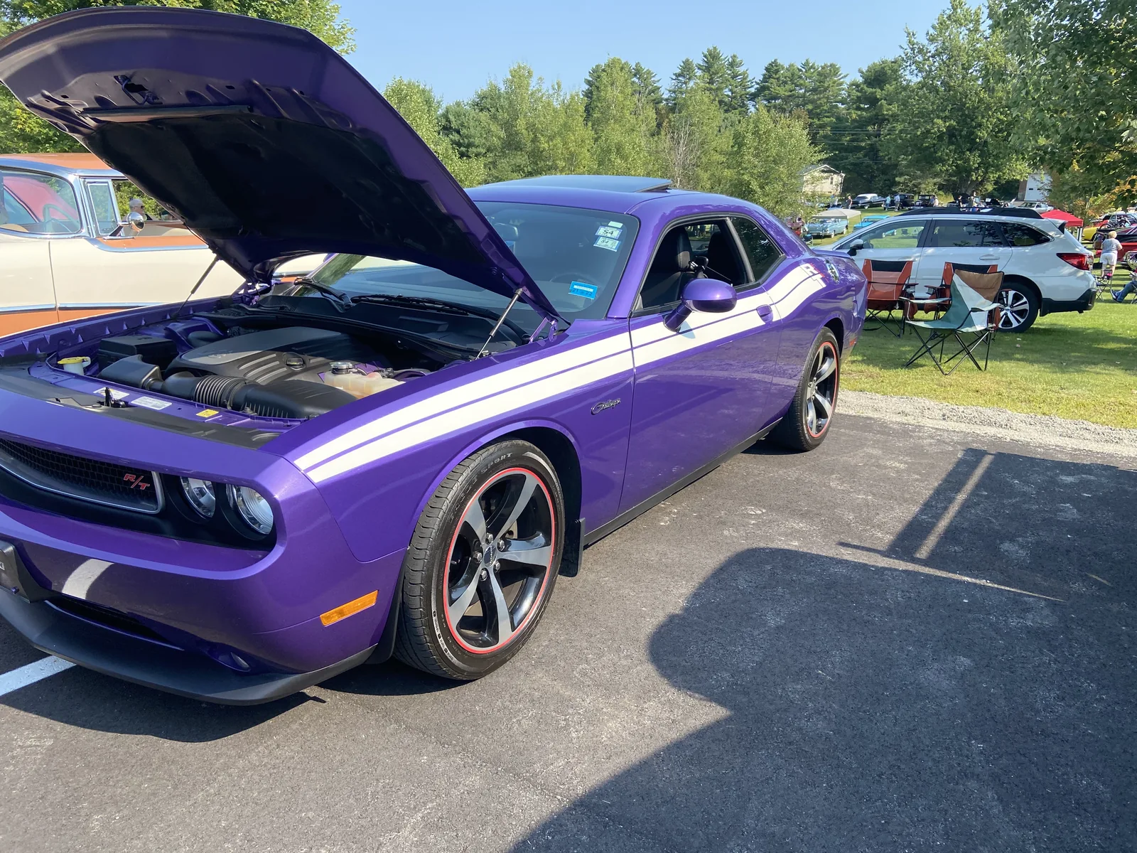 Purple 2013–2014 Dodge Challenger R/T Classic with its hood open at Freddie's Cruise-In 2022.