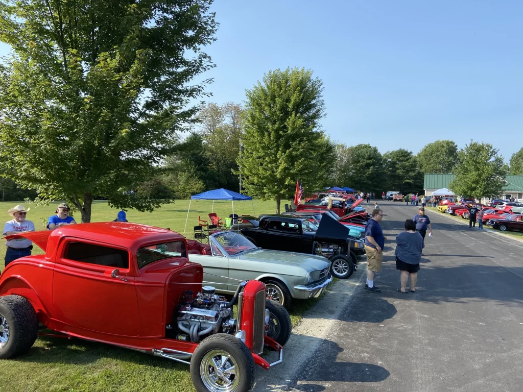 Red hot rod and a line of show cars at Freddie's Cruise-In 2022.