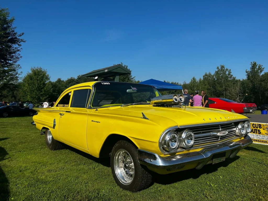 Yellow 1960 Chevrolet Biscayne at Freddie's Cruise-In 2023.