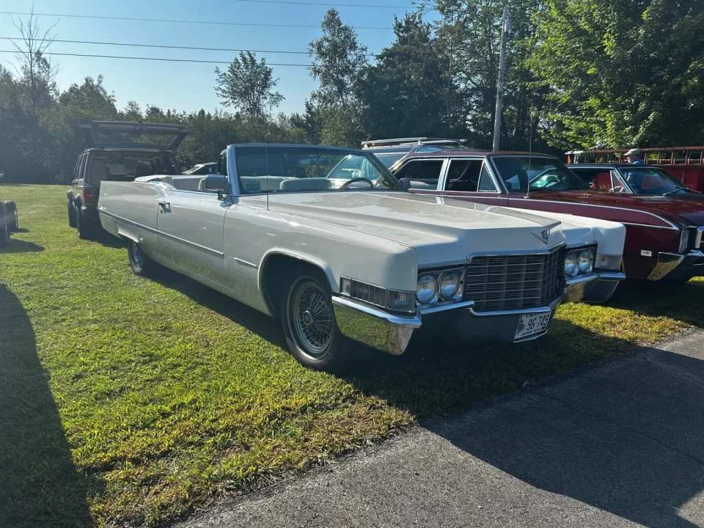 White 1969 Cadillac DeVille convertible at Freddie's Cruise-In 2023.