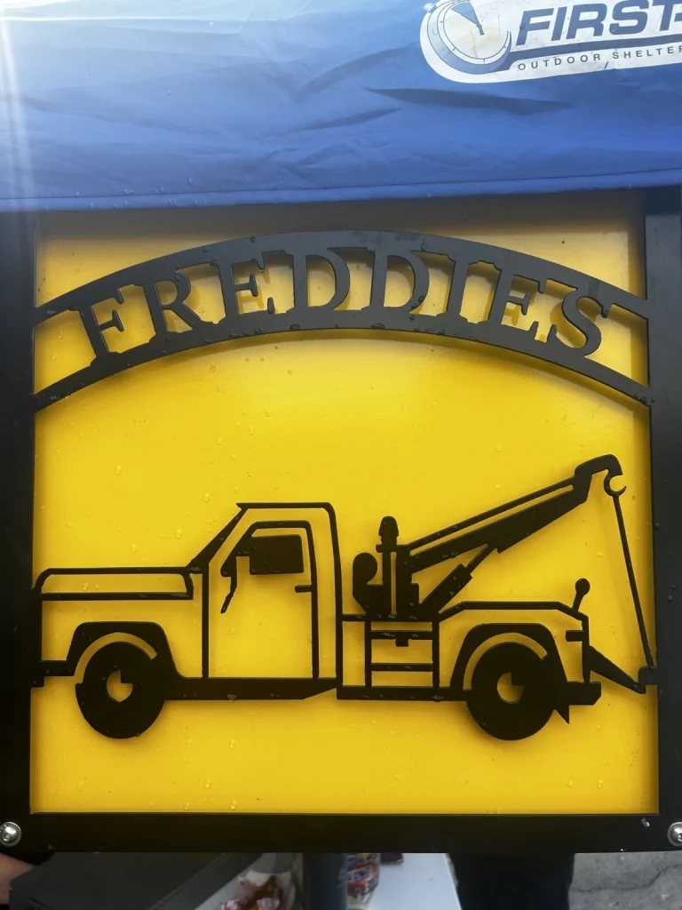 Freddie's wrecker sign at Freddie's Cruise-In 2023.