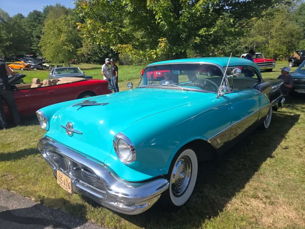 Turquoise 1956 Oldsmobile Super 88 Holiday Coupe at Freddie's Cruise-In 2026 in Vassalboro, Maine.