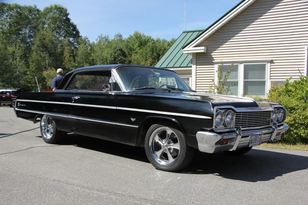 Black classic Chevrolet parked beside the Vassalboro Town Office at Freddie's Cruise-In 2026.