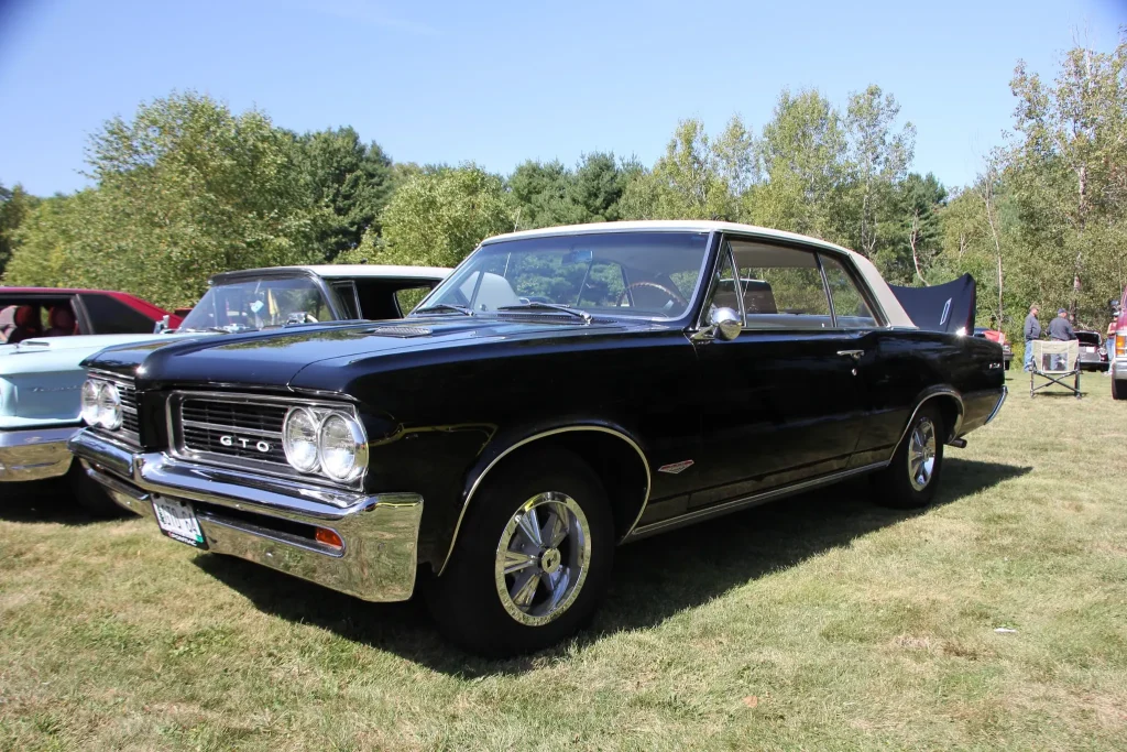 Black Pontiac displayed on the grass at Freddie's Cruise-In 2026 in Vassalboro, Maine.